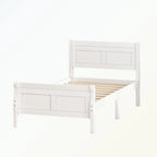 Lit plateforme en bois avec tête de lit, pied de lit et sommier à lattes.