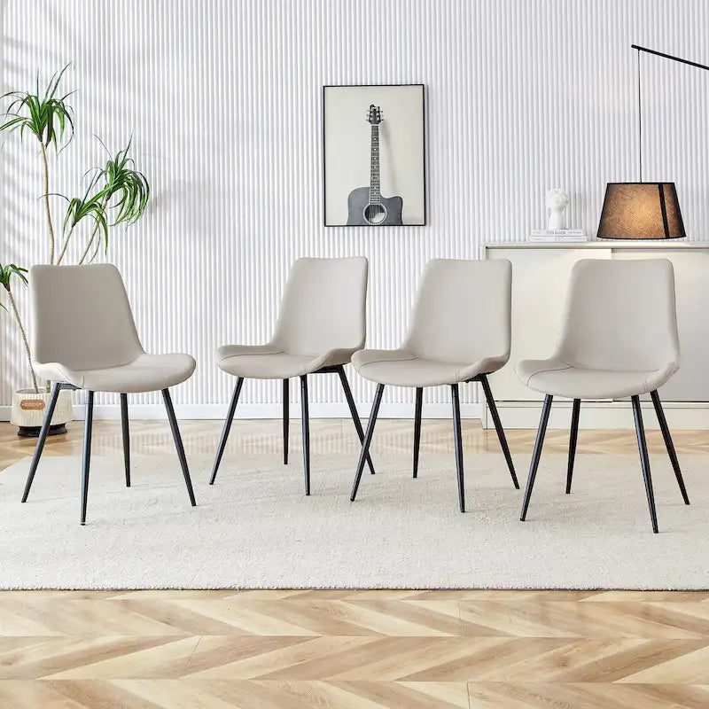 Ensemble de 4 chaises de restaurant rembourrées avec dossiers en daim et pieds en métal noir, convenant aux cuisines, salons et maisons de campagne.