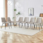 Ensemble de 4 chaises de restaurant rembourrées avec dossiers en daim et pieds en métal noir, convenant aux cuisines, salons et maisons de campagne.